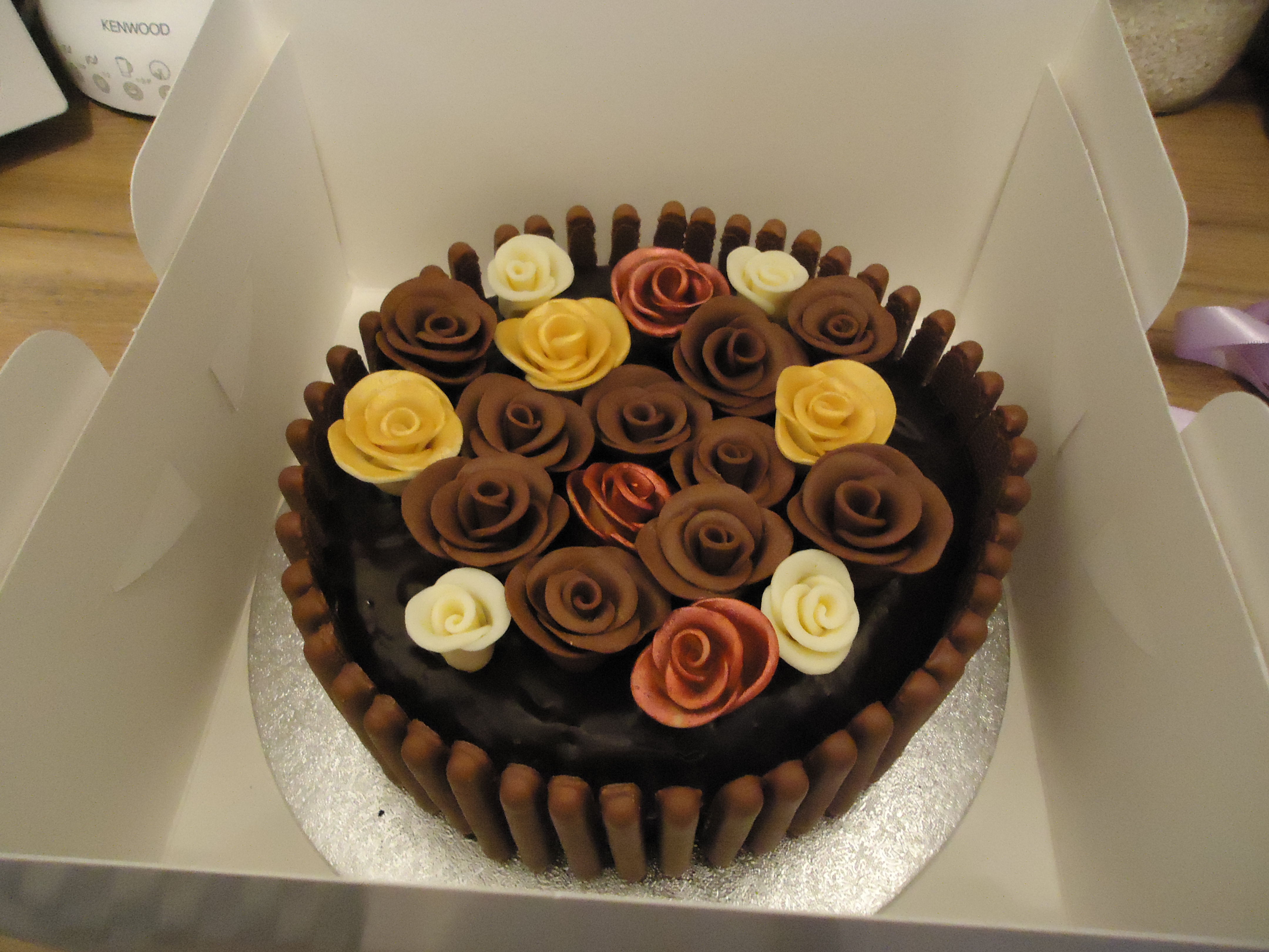 and chocolate roses in milk chocolate white red and gold